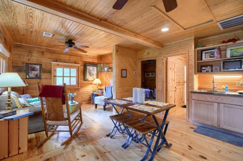 a kitchen and living room in a log cabin at Bison Hollow Hideaway in South Bloomingville