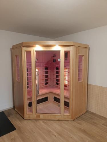 a wooden cabinet sitting on the floor in a room at Chalupa u Martina in Vápenice