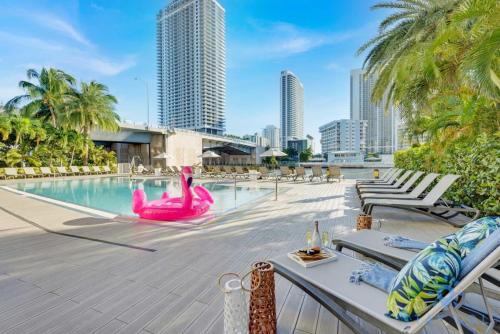a pool with a pink flamingo in the middle of a city at Amazing Studio with Balcony & Pool in Hallandale Beach
