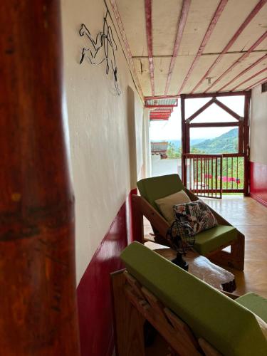 a room with a couch and a chair in it at Finca La Macarena by Welttisch in Génova