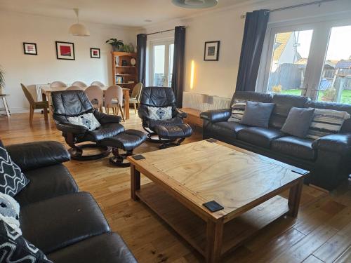 a living room with couches and a coffee table at Beolary in Oban