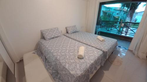 Ένα ή περισσότερα κρεβάτια σε δωμάτιο στο Flat lençóis park bhs