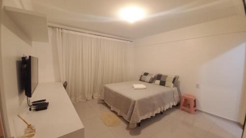 Ένα ή περισσότερα κρεβάτια σε δωμάτιο στο Flat lençóis park bhs