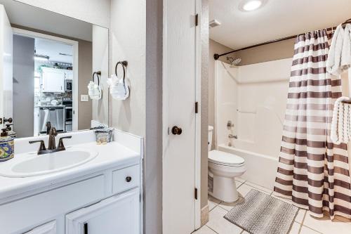 a bathroom with a sink and a toilet at 1 Mi to Silver Dollar City! Lake-View Family Haven in Branson