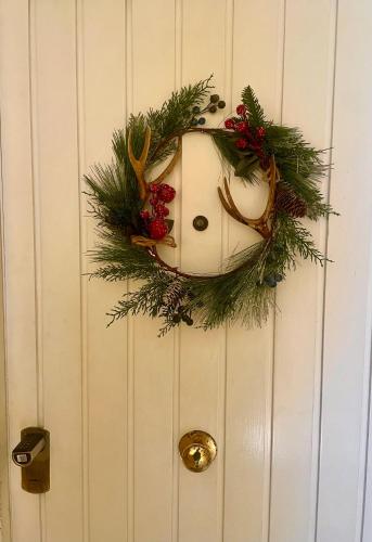 a wreath on a door with a santa face on it at The Attic in Civitavecchia