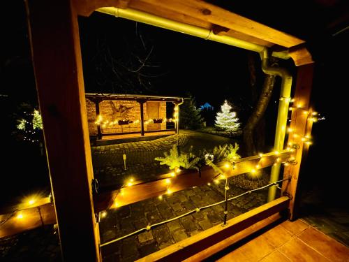 a view of a porch with lights at night at Elements Lednice in Lednice