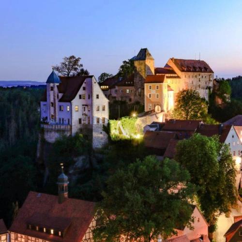 a group of buildings in a town at night at Ferienwohnung "EDDI" in Hohnstein
