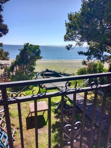a view of the beach from a balcony at La pincoya in Chonchi