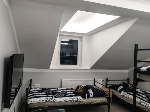 Ένα ή περισσότερα κρεβάτια σε δωμάτιο στο Hostel Płock