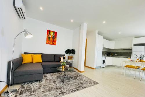 a living room with a couch and a table at Sal Little Heart Apartment 21 in Santa Maria