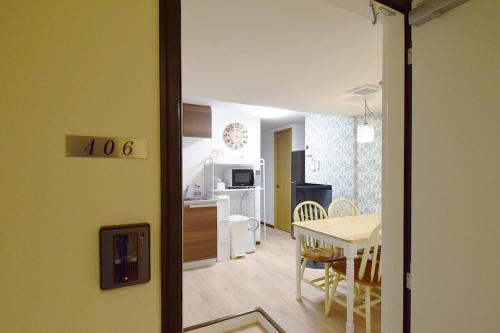 a kitchen and dining room with a table and a dining room at Hostel In Kyoto Gion - Vacation STAY 13917v in Gionmachi