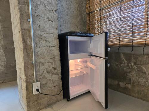 an empty refrigerator with its door open in a room at Mikasakan - Vacation STAY 18019 in Kinokawa