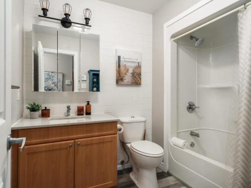 a bathroom with a toilet and a sink and a shower at Ski In Out view on Mont-Blanc hills - Le Loup in Mont-Blanc