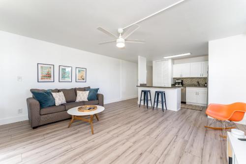a living room with a couch and a table at Welcome to Gorgeous Hideout – Your Serene Hawaiian Escape! in Kahuku