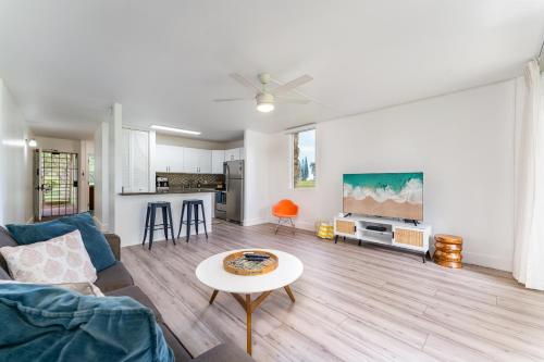 a living room with a couch and a table at Welcome to Gorgeous Hideout – Your Serene Hawaiian Escape! in Kahuku