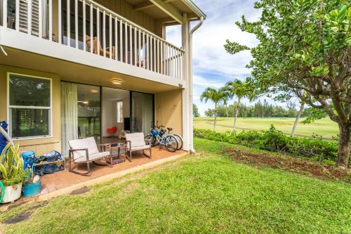 a house with a patio with a table and chairs at Welcome to Gorgeous Hideout – Your Serene Hawaiian Escape! in Kahuku