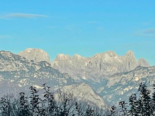 a view of a mountain range with snow covered mountains at Rifugio Pranolz in Trichiana