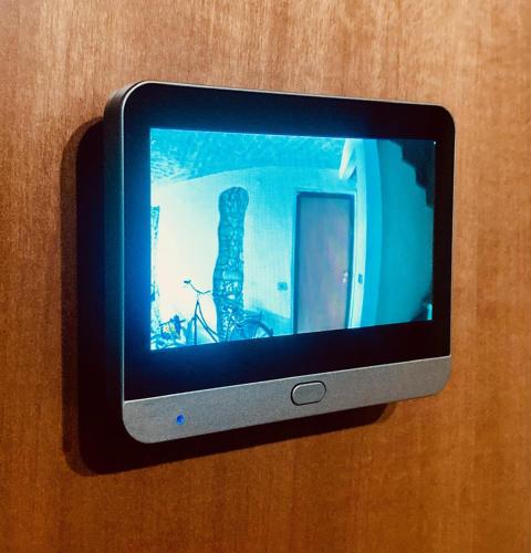 a television on a wall with a skeleton on the screen at Residenza Borgo 9 in Collecchio