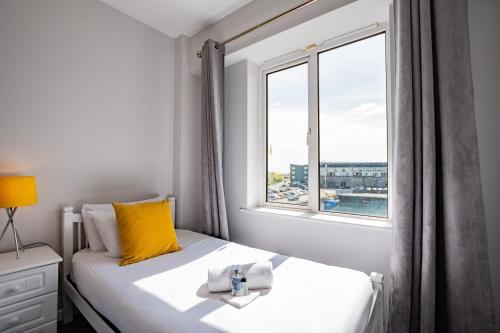 a bedroom with a bed and a window at Radharc na mBáid in Galway