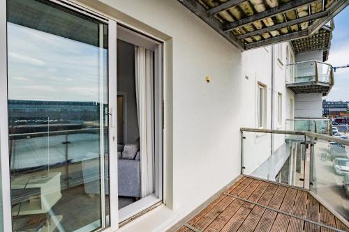 a balcony with a view of the ocean at Radharc na mBáid in Galway
