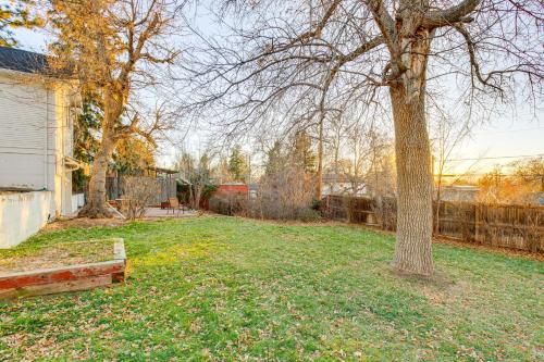 a yard with a tree and a fence at Spacious Home with Fenced Yard 6 Mi to Dtwn Denver! in Englewood