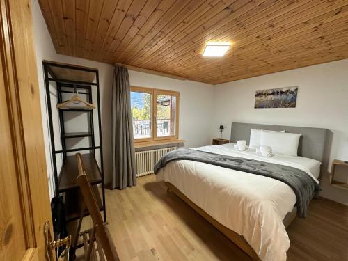 Postel nebo postele na pokoji v ubytování Waldhaus Laax