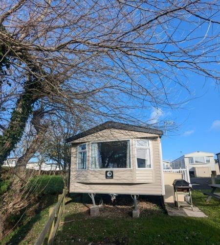 a small house with the number on it at Swift Loire Holiday Home sleeps 6 Haven Littlesea in Weymouth