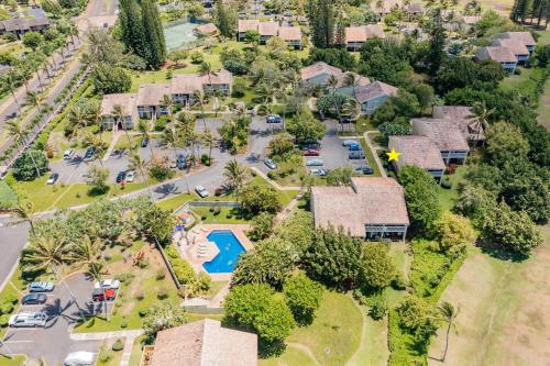 an aerial view of a house with a pool and trees at Plumeria Tree Hale - Golf Course View - Sleeps 4 in Kahuku