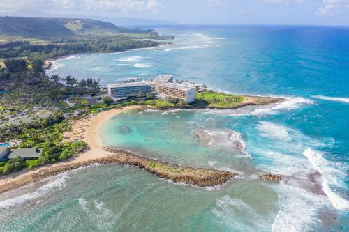 an aerial view of a resort on a beach at Plumeria Tree Hale - Golf Course View - Sleeps 4 in Kahuku