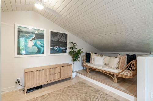 a living room with a couch and a table at The Drifter - North Shore Loft - Relaxed Luxury in Kahuku