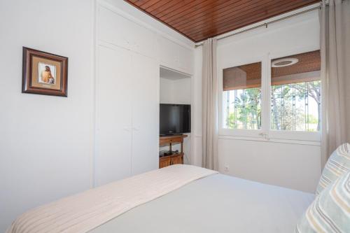 Un pat sau paturi într-o cameră la Encantadora villa con Piscina,Spa y cerca de playa