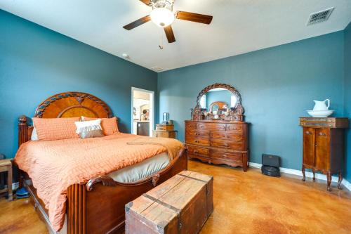 a bedroom with a bed and a dresser and a mirror at Family-Friendly Johnson City Home Near State Parks in Hye