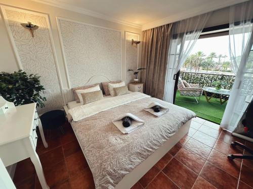 Postel nebo postele na pokoji v ubytování Perla Paraiso Royal