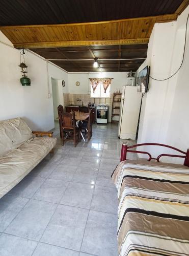 a living room with a couch and a table at Hospedaje Don Felix in General Acha