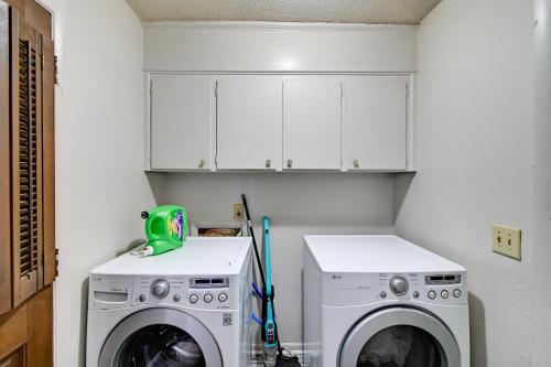 a laundry room with a washer and dryer at Near Fort Liberty Home with Yard in Fayetteville! in Fayetteville