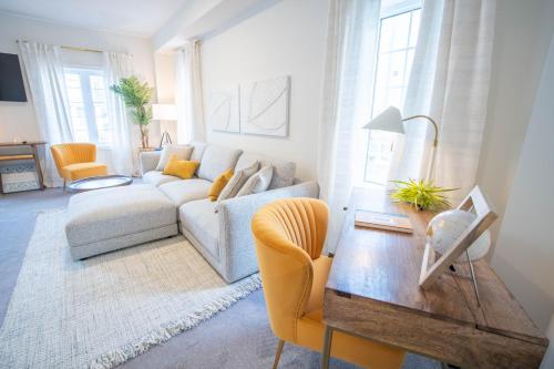 a living room with a couch and a table at The Cozy Corner in Hamilton