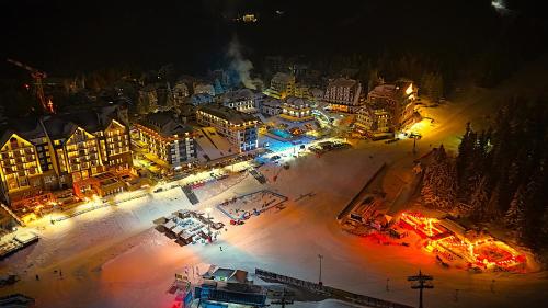 an aerial view of a city at night with lights at SKI MONTIS apartmani - Kopaonik centar in Kopaonik