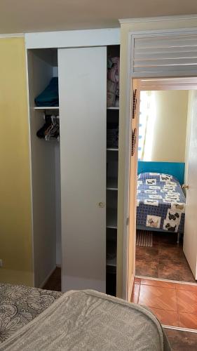 En eller flere senge i et værelse på apartamento playa 4 esquinas