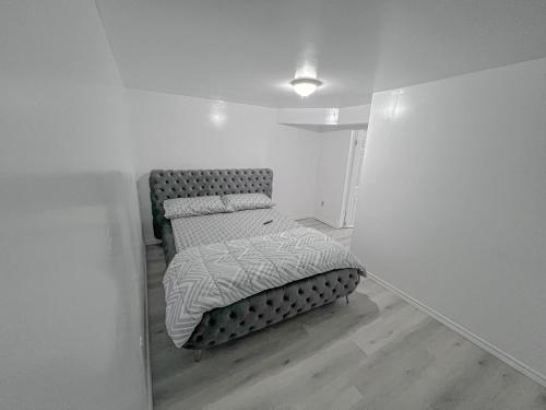 a small bedroom with a bed in a room at Private Room Near Airport D6 in Brampton