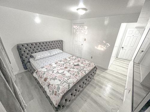 a bedroom with a bed in a room with a door at Private Room Near Airport D5 in Brampton