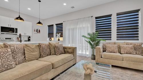 a living room with a couch and a table at Luxe Retreat in the Heart of Dallas l Pet-Friendly in Dallas