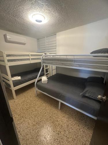 a room with two bunk beds in a dorm room at relax house in San Lorenzo