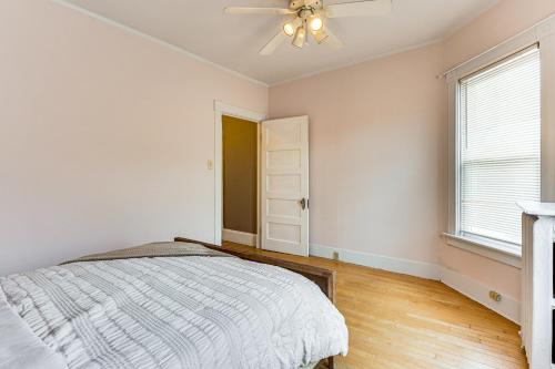 a bedroom with a bed and a ceiling fan at Ski, Hike and Fish Modern Rutland Home in Rutland