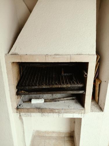 a brick oven in a wall in a room at Departamento Torre Cabildo in San Salvador de Jujuy