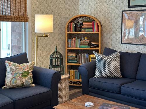 a living room with two blue couches and a book shelf at Cape May Classic Design that is Cozy, Elegant, and Inviting in Cape May