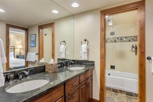 a bathroom with two sinks and a shower at Luxury 2 Bedroom Lionshead Village Condo, Short Walk To Gondola in Vail