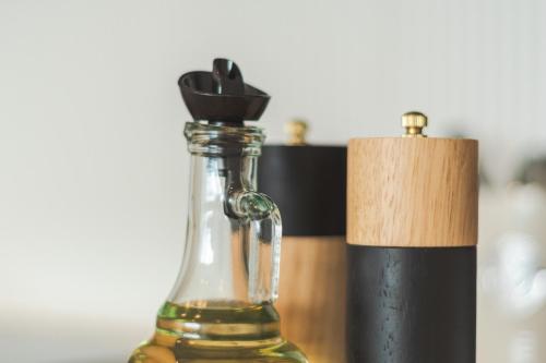 a bottle of wine on a table next to a candle at Loft By Toore Patagonia in Puerto Natales