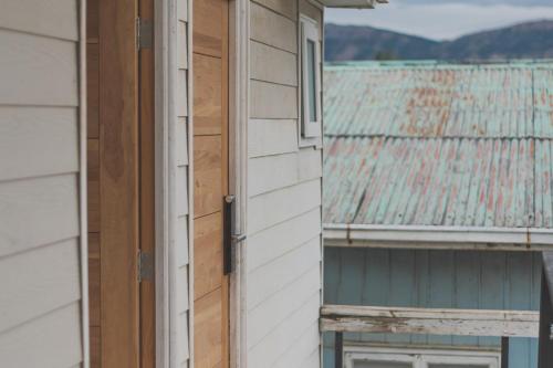 an open door to a house with a roof at Loft By Toore Patagonia in Puerto Natales
