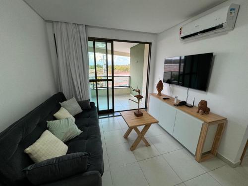 TV a/nebo společenská místnost v ubytování Flat Carneiros Beach Resort - Beira Mar Praia dos Carneiros