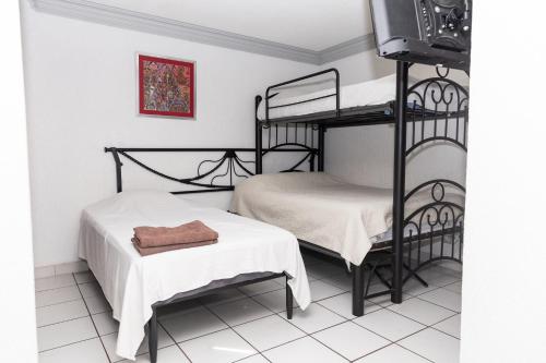Postel nebo postele na pokoji v ubytování Lofts Oaxaca